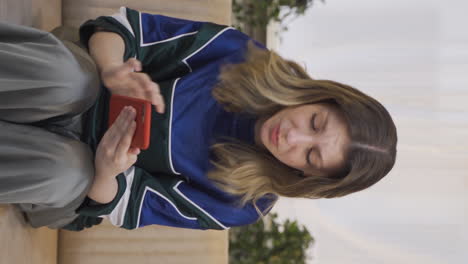 Vertical-video-of-Young-woman-getting-breakup-texting-gets-upset.